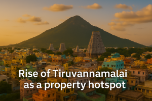 Scenic view of Tiruvannamalai with Arunachala hill in the background, open land in the foreground, and overlay text reading 'Rise of Tiruvannamalai as a Property Hotspot'.